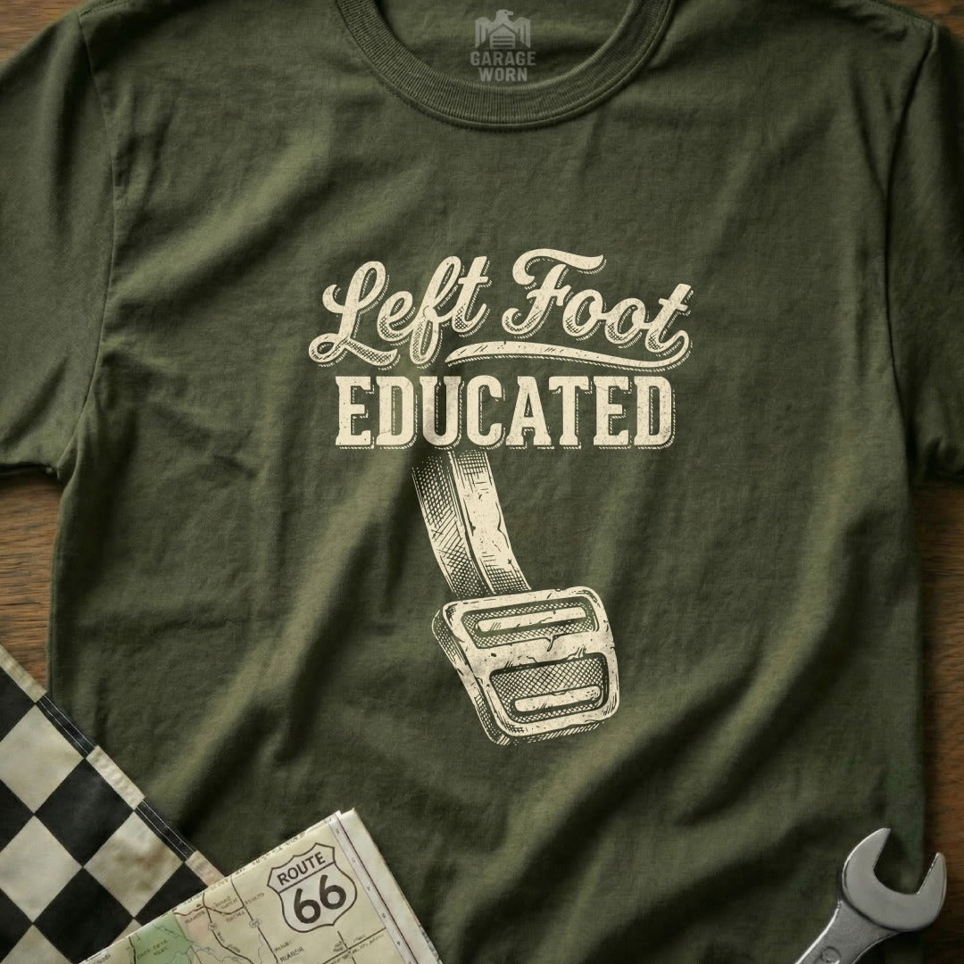 Olive green t-shirt with "Left Foot Educated" text and graphic of a clutch pedal.