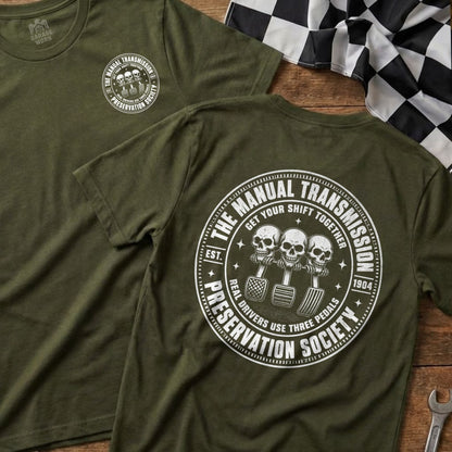 Green t-shirt with "The Manual Transmission Preservation Society" circular graphic.