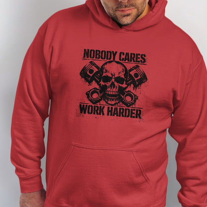Red hoodie with black graphic of skull and pistons with text "NOBODY CARES WORK HARDER."