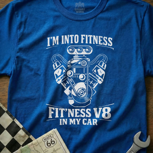 Blue t-shirt with "I'm into fitness fit'ness V8 in my car" graphic.