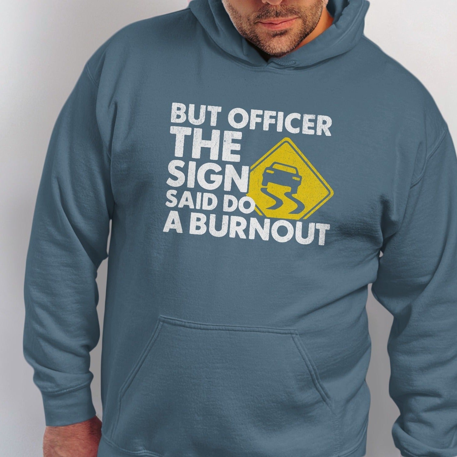 Blue hoodie with text: "But Officer The Sign Said Do A Burnout" and a slippery road sign.