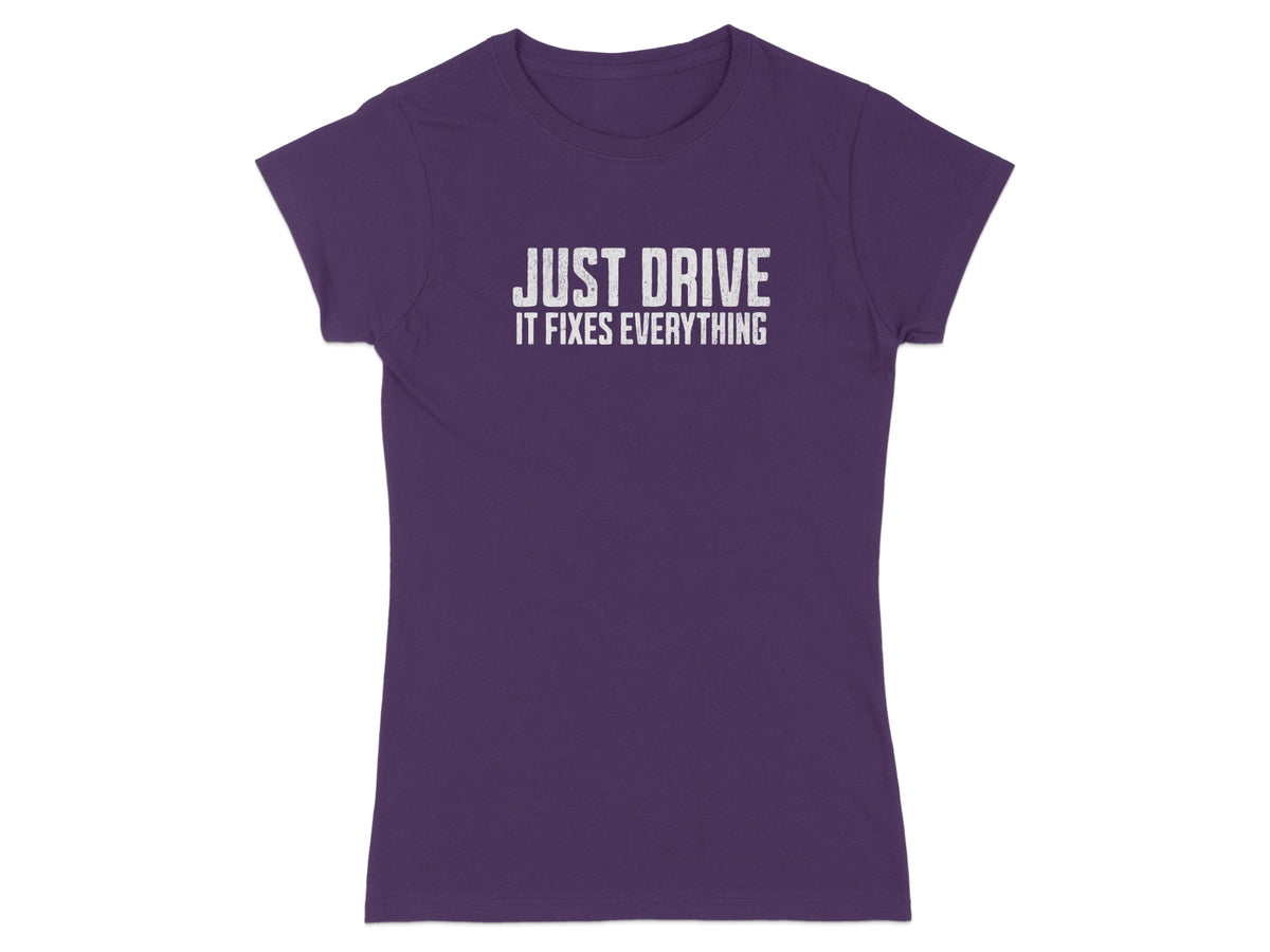 Purple t-shirt with white text that reads "JUST DRIVE IT FIXES EVERYTHING".