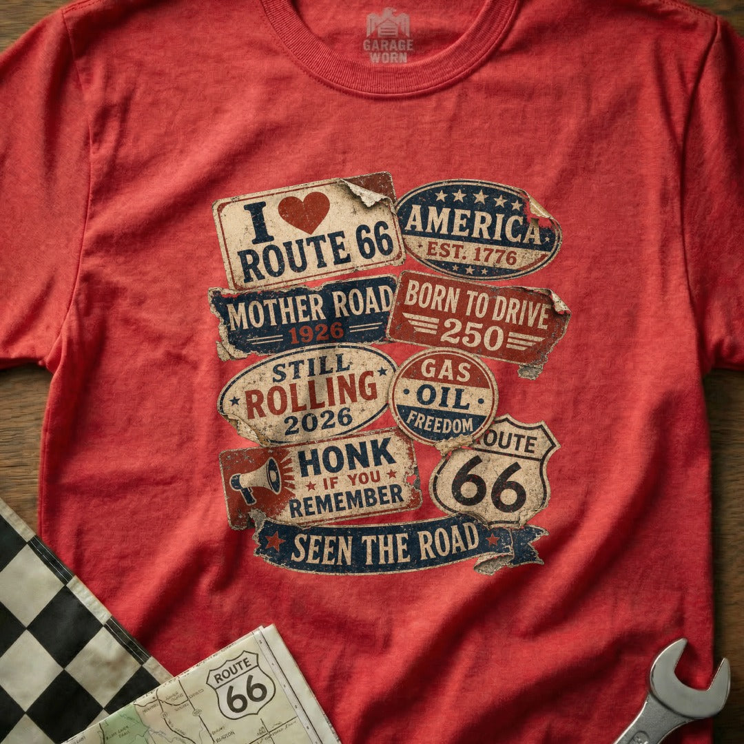 Red t-shirt with Route 66 graphics and vintage slogans about driving and America.