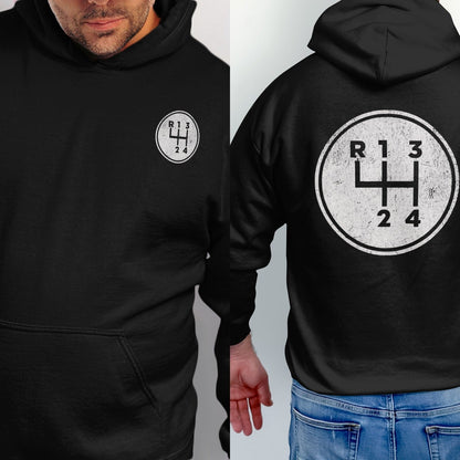 Black hoodie with a circular graphic of a manual car gear shift pattern.