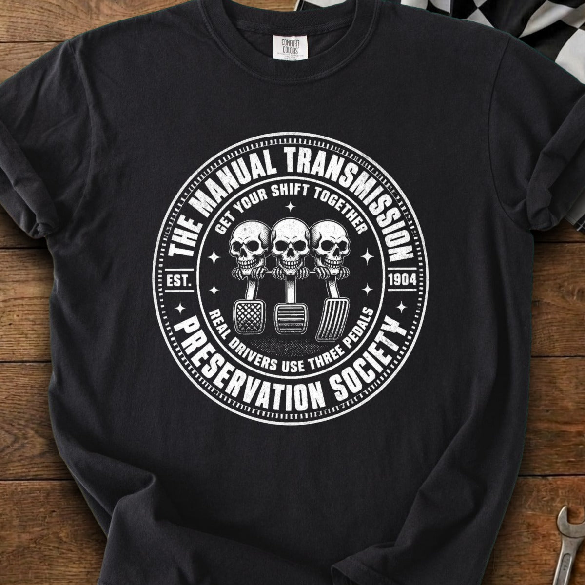 Black t-shirt with "The Manual Transmission Preservation Society" circle graphic featuring skulls.