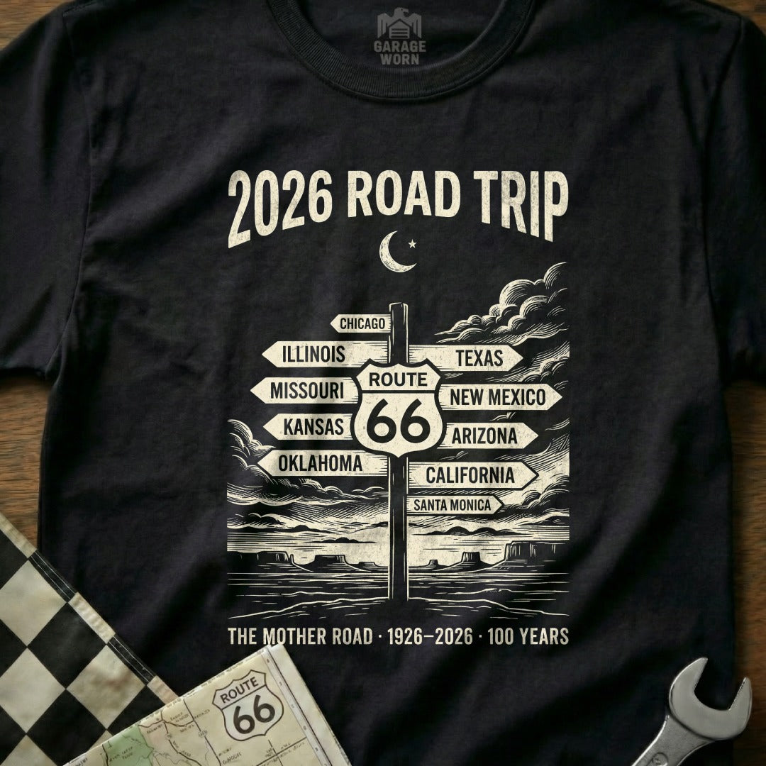 Black t-shirt with "2026 Road Trip" and Route 66 destinations sign.