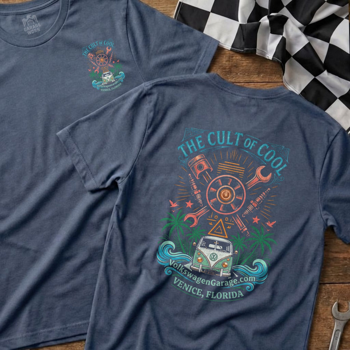 Blue t-shirt with "The Cult of Cool" graphic featuring a VW van, tools, and palms.