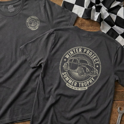 Dark t-shirt with circular "Winter Project Summer Trophy" graphic featuring a Beetle.