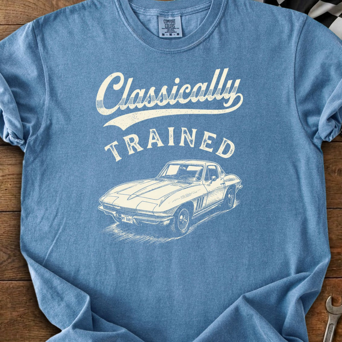 Blue t-shirt with "Classically TRAINED" text and a vintage car sketch.