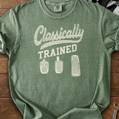 Green t-shirt with "Classically TRAINED" and three manual transmission pedals graphic.