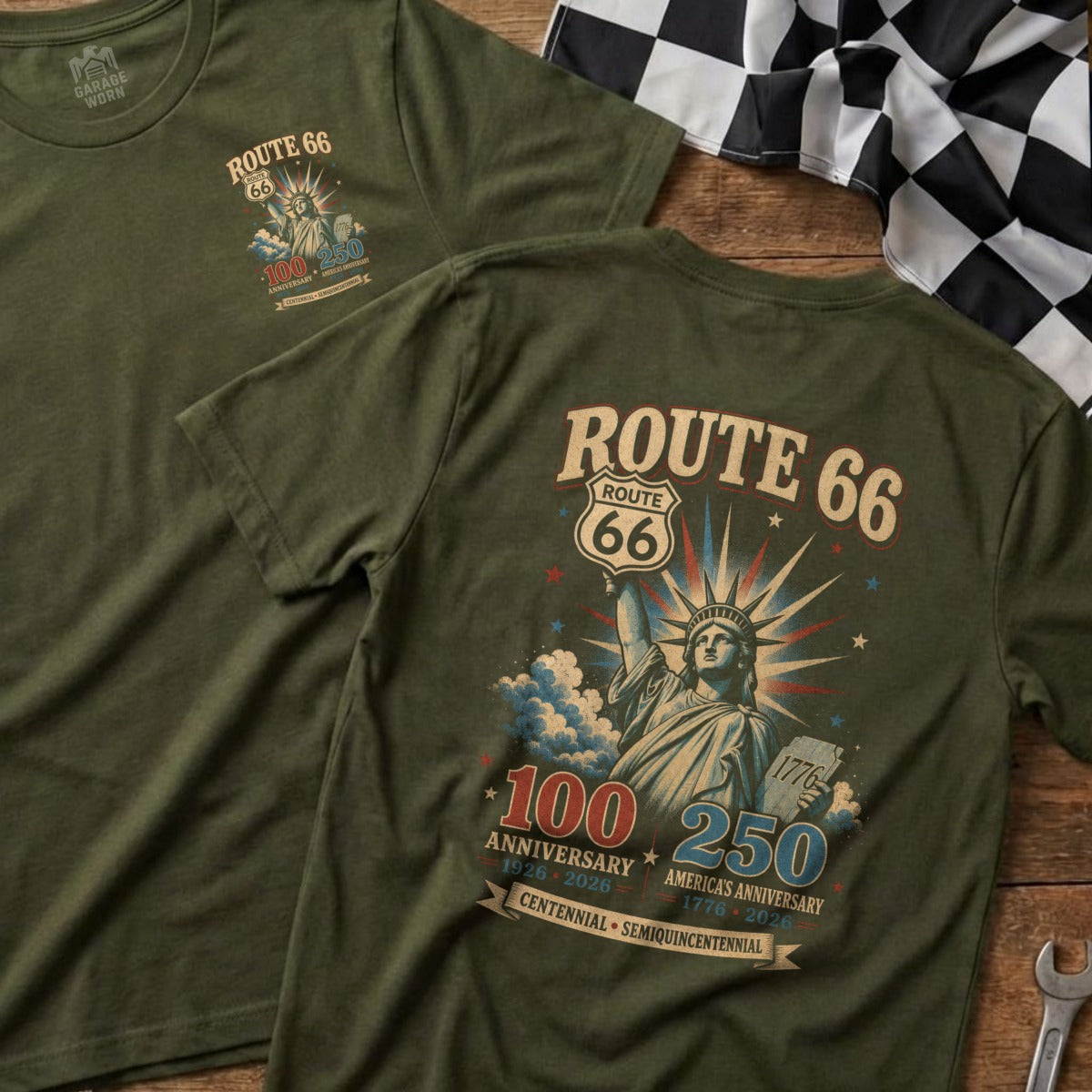 Olive green t-shirt with "Route 66" and Statue of Liberty graphic celebrating anniversaries.