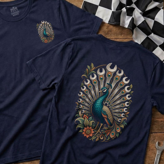 Navy t-shirt with a peacock graphic made of wrenches and accented with flowers.