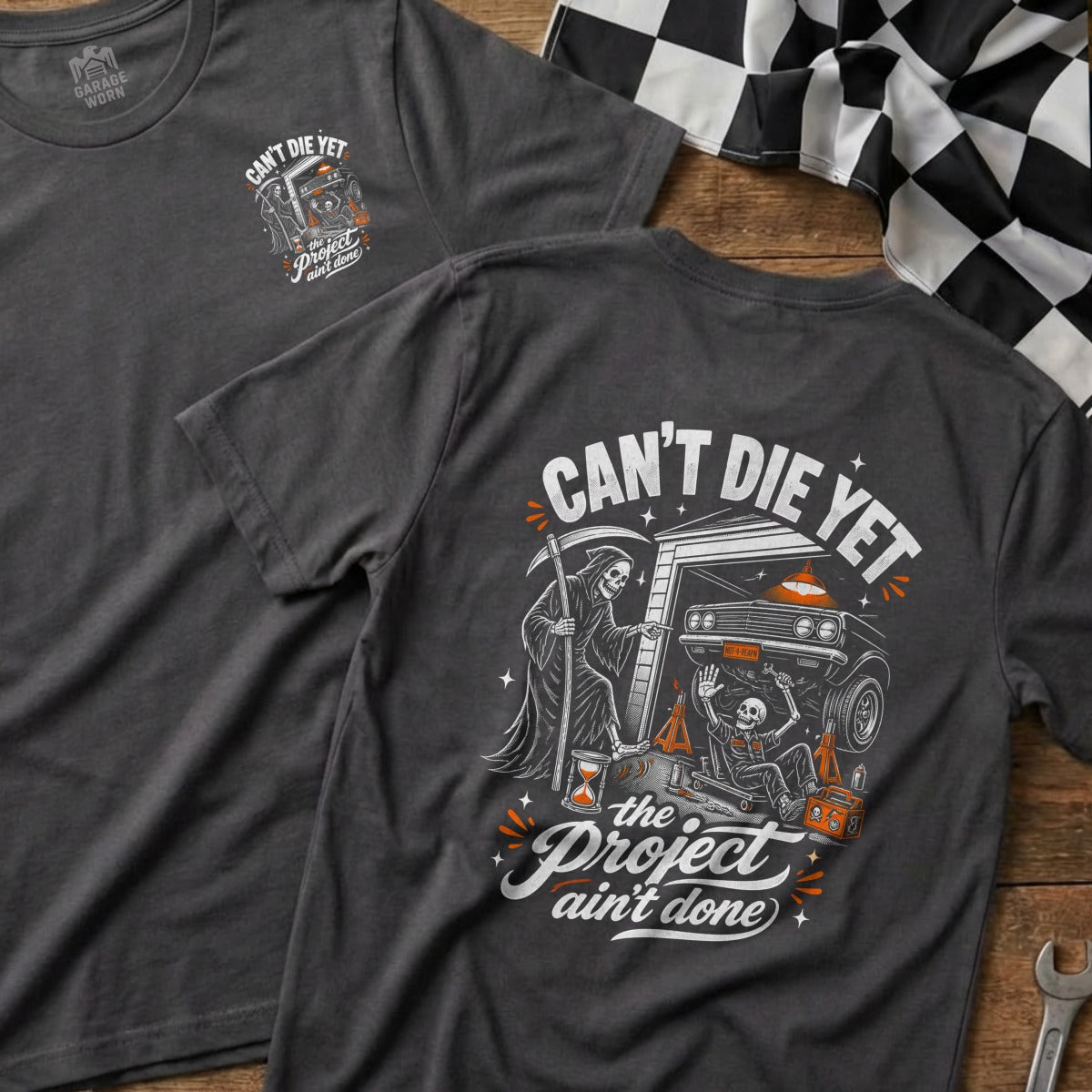 T-shirt with Grim Reaper, skeleton, car, and "Can't Die Yet the Project Ain't Done" text.