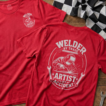 Red t-shirts with "Welder by Trade, Artist by Accident" graphic.