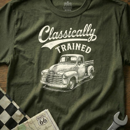 Olive green t-shirt with "Classically TRAINED" text and sketch of an old pickup truck.
