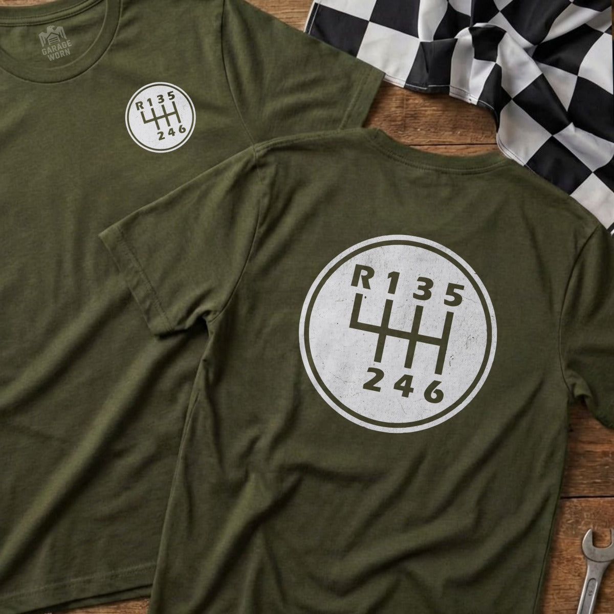 Green t-shirts featuring a white manual transmission shift pattern graphic.