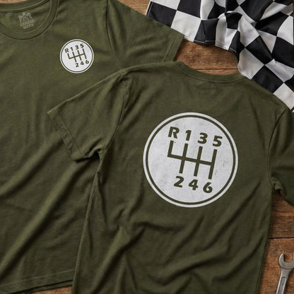 Green t-shirts featuring a white manual transmission shift pattern graphic.