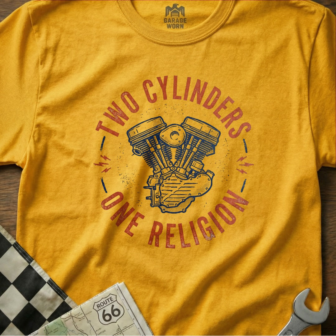 Yellow t-shirt with "Two Cylinders, One Religion" and motorcycle engine graphic.