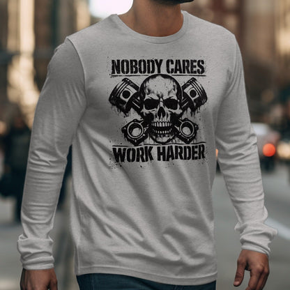 Gray long-sleeve shirt with skull, pistons, and text reading "NOBODY CARES WORK HARDER".