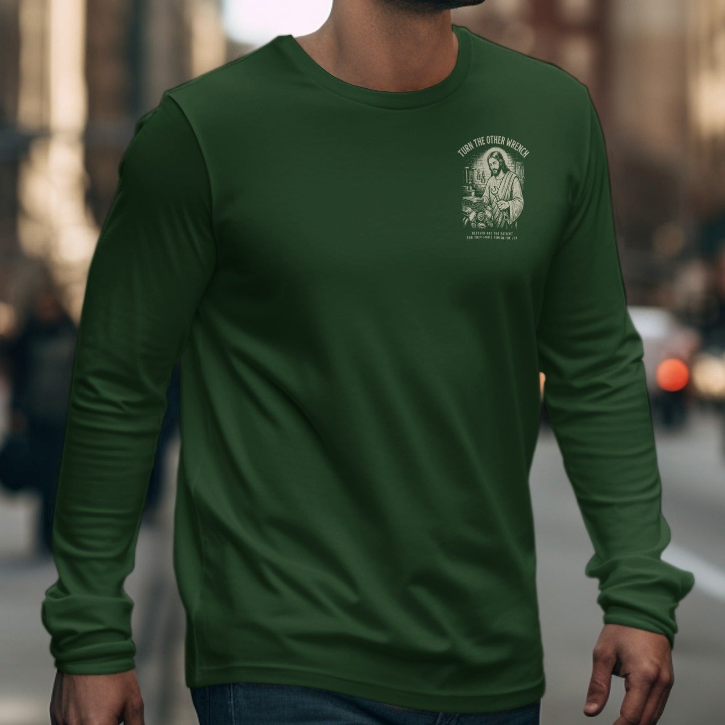 Green long-sleeve shirt with illustration of Jesus holding a wrench.