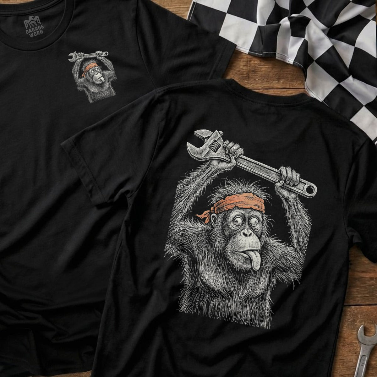 T-shirt with monkey holding wrench and tongue out, back view.