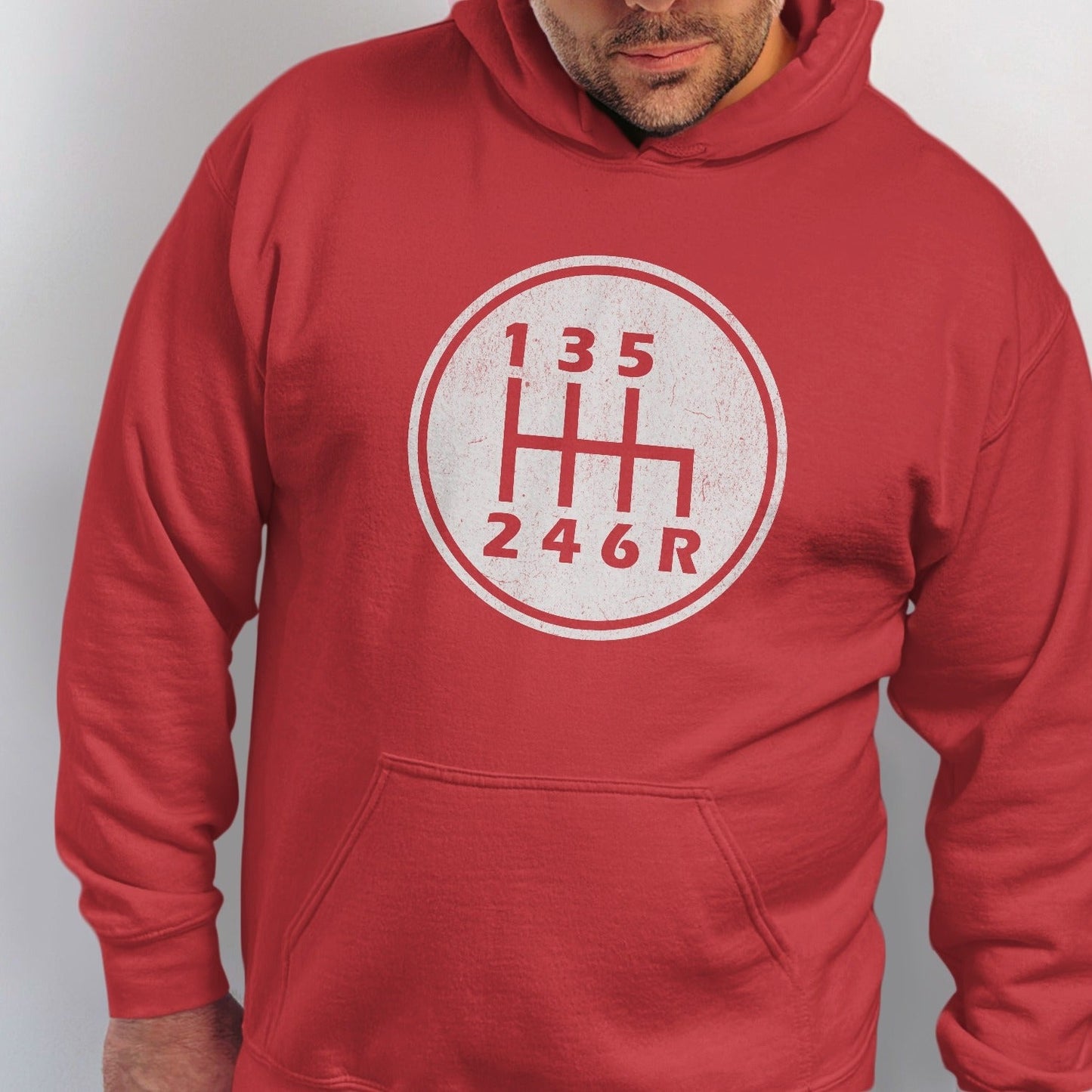Red hoodie with a circular graphic of a manual transmission shift pattern.