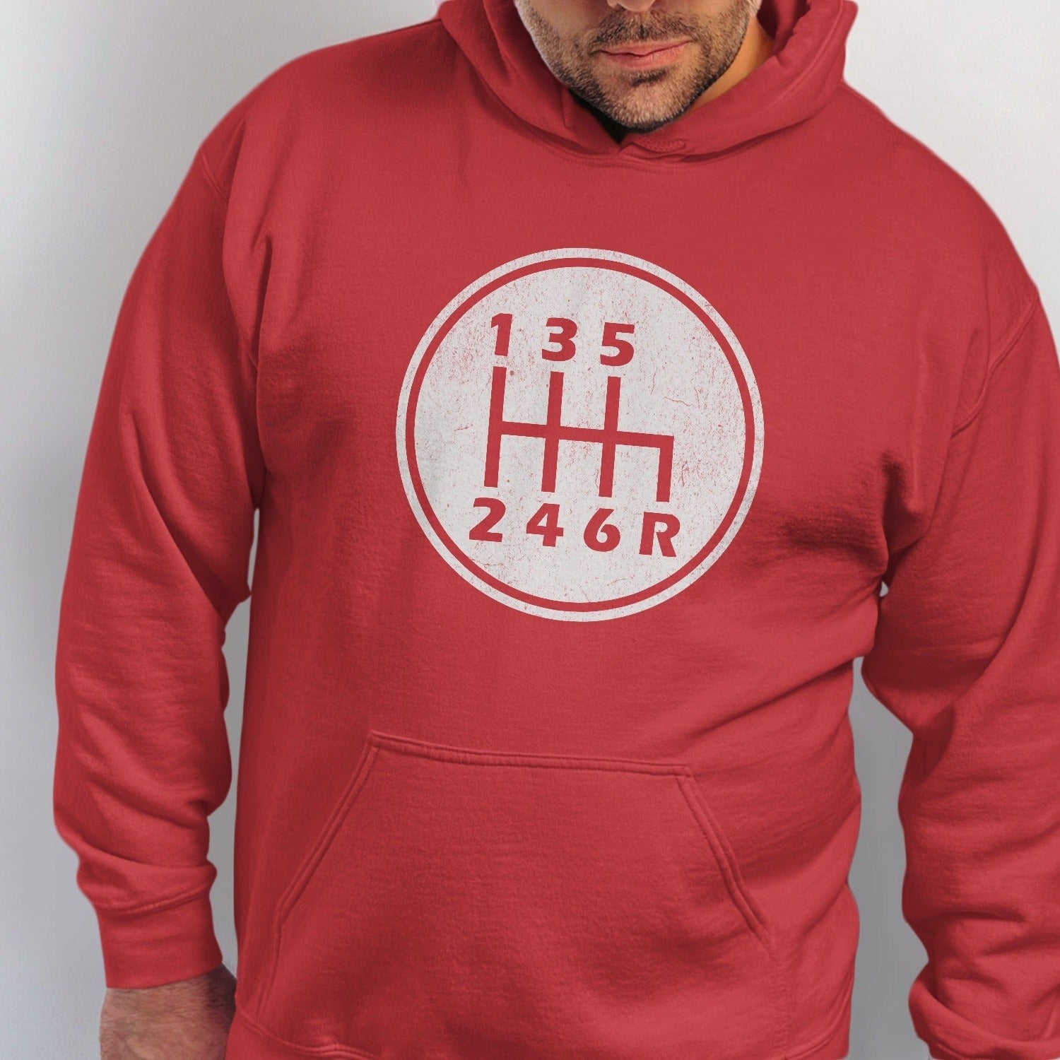 Red hoodie with a circular graphic of a manual transmission shift pattern.