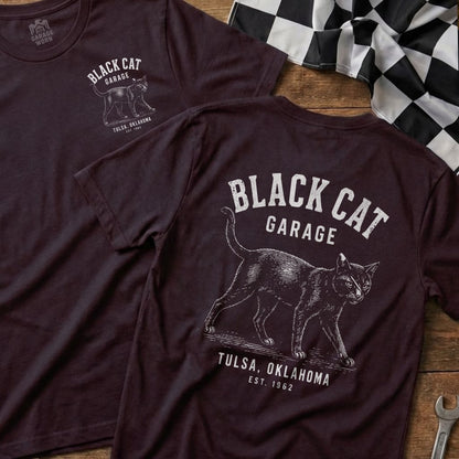 Dark t-shirt with "Black Cat Garage Tulsa, Oklahoma Est. 1962" and cat graphic.