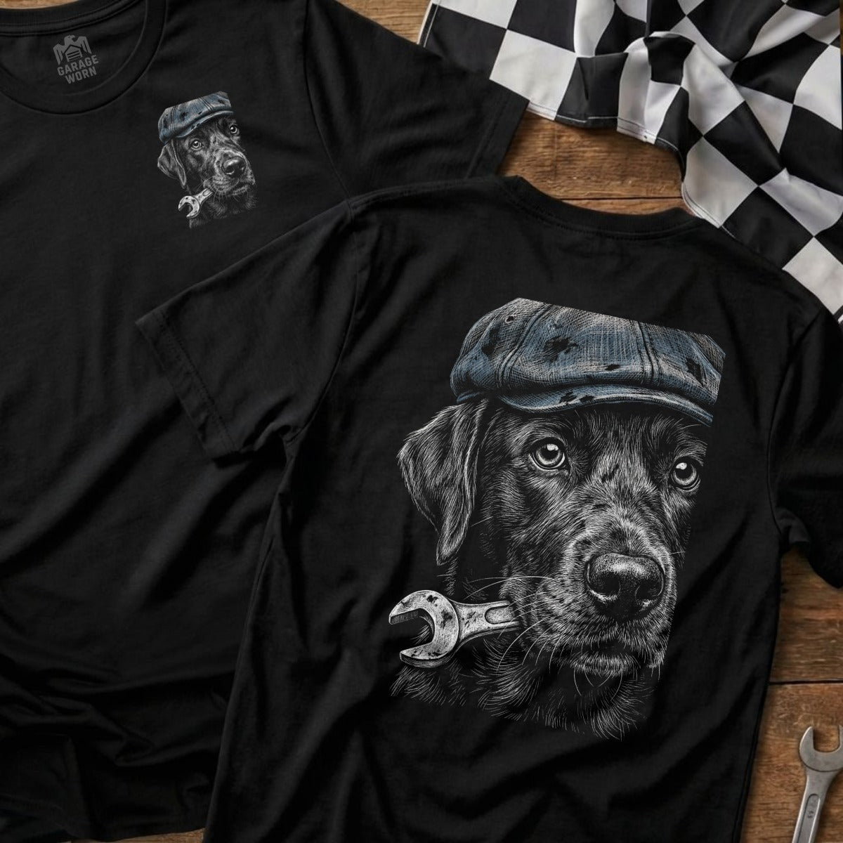Black Labrador wearing a cap holds a wrench in its mouth.