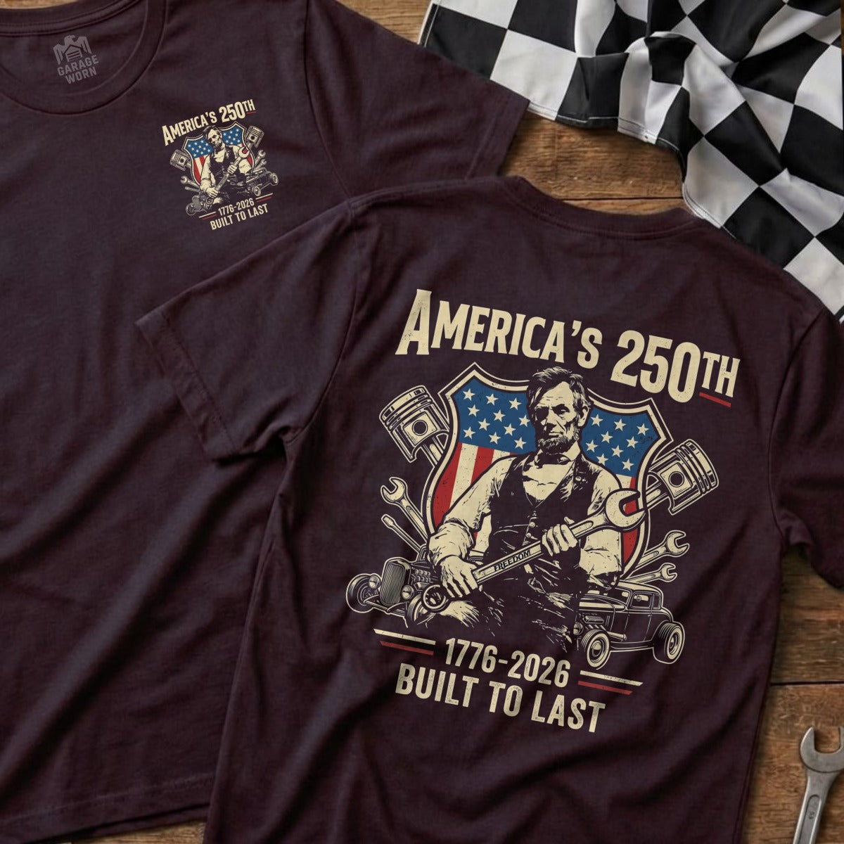 Burgundy t-shirt with "America's 250th" graphic featuring Abraham Lincoln and pistons.