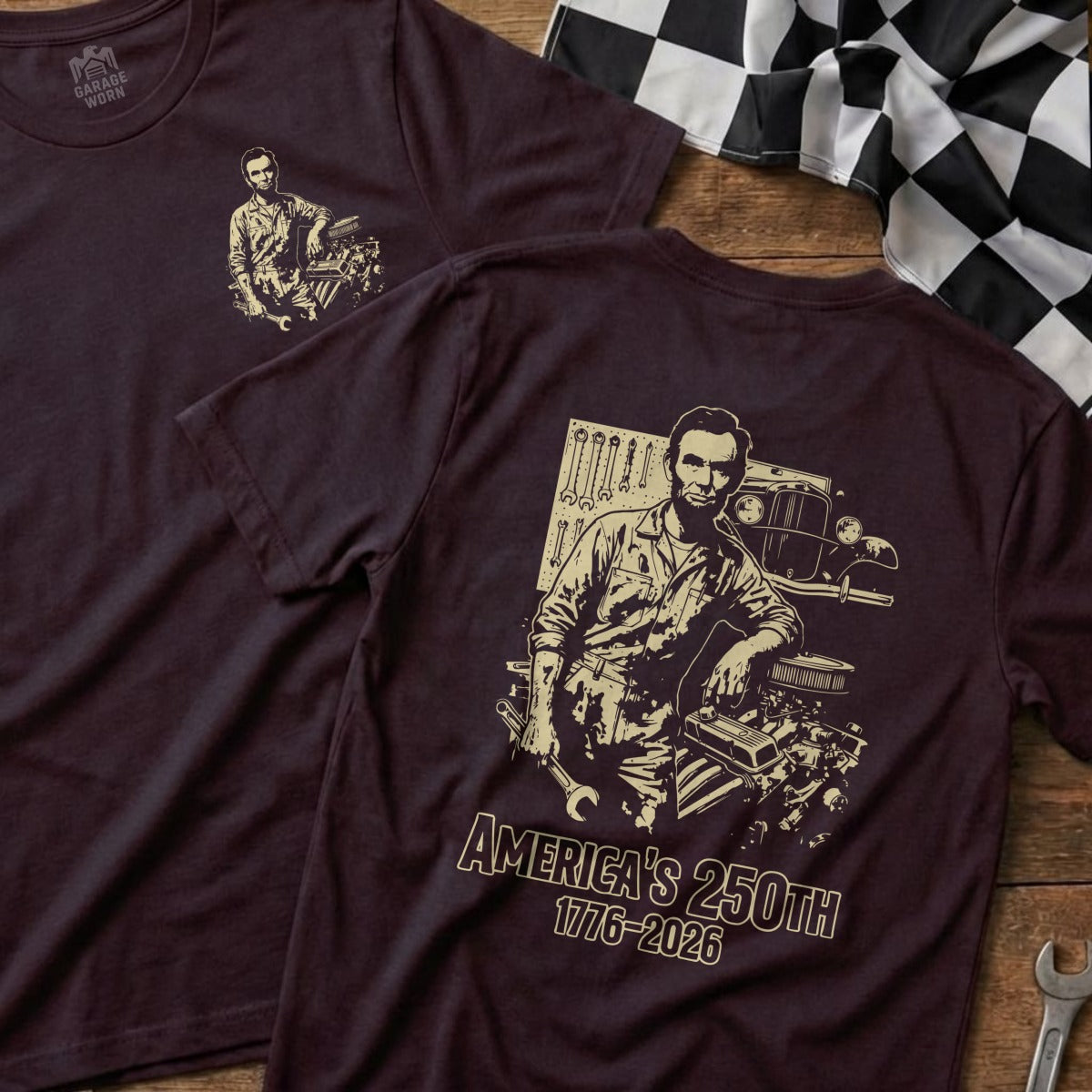 Burgundy t-shirt featuring Abraham Lincoln and an engine, text reads "AMERICA'S 250TH 1776-2026".