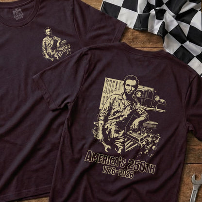 Burgundy t-shirt featuring Abraham Lincoln and an engine, text reads "AMERICA'S 250TH 1776-2026".