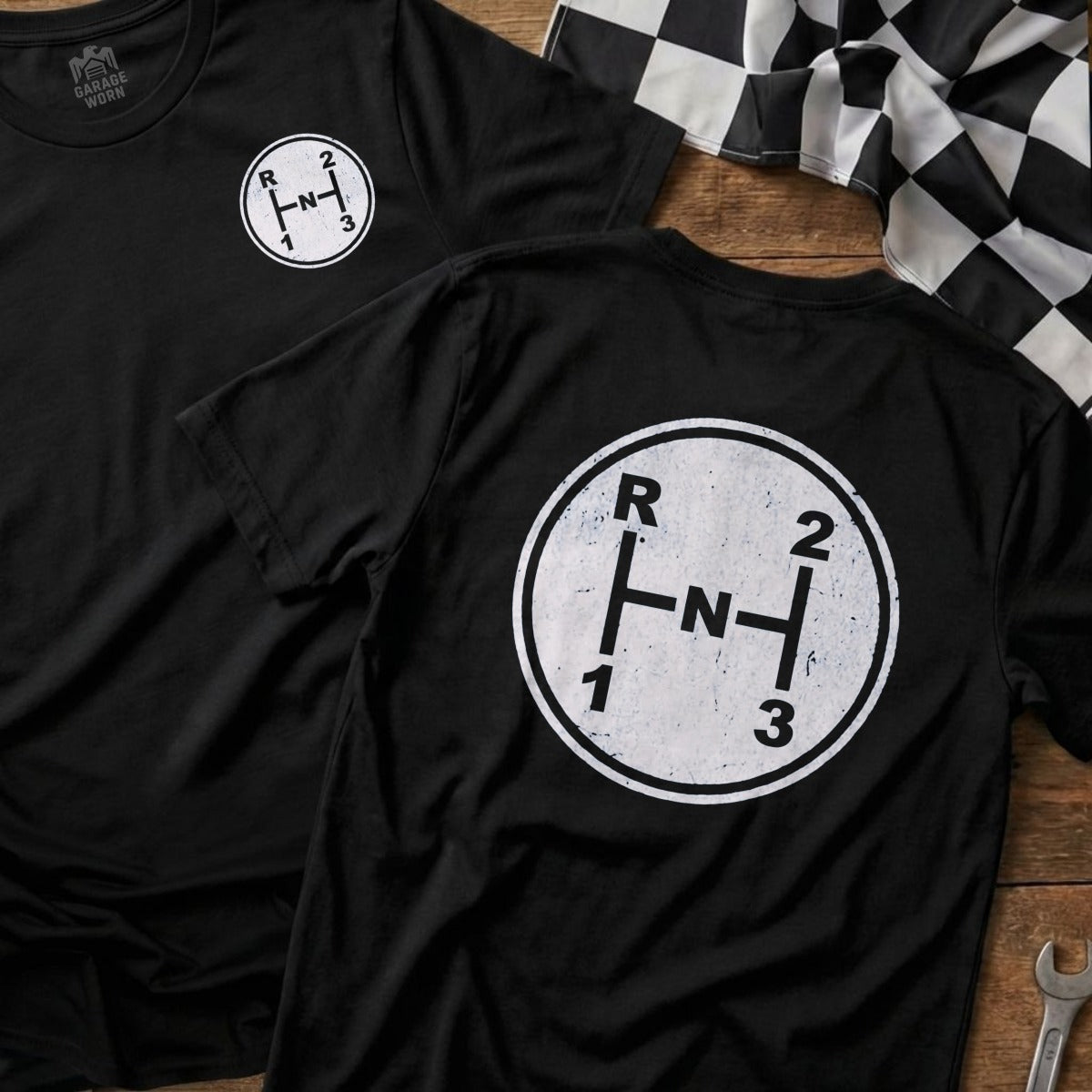 Black t-shirt with a vintage manual transmission shift pattern graphic.