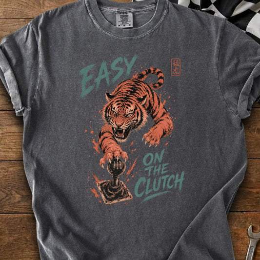 Tiger lunging at gear shift with text "EASY ON THE CLUTCH"