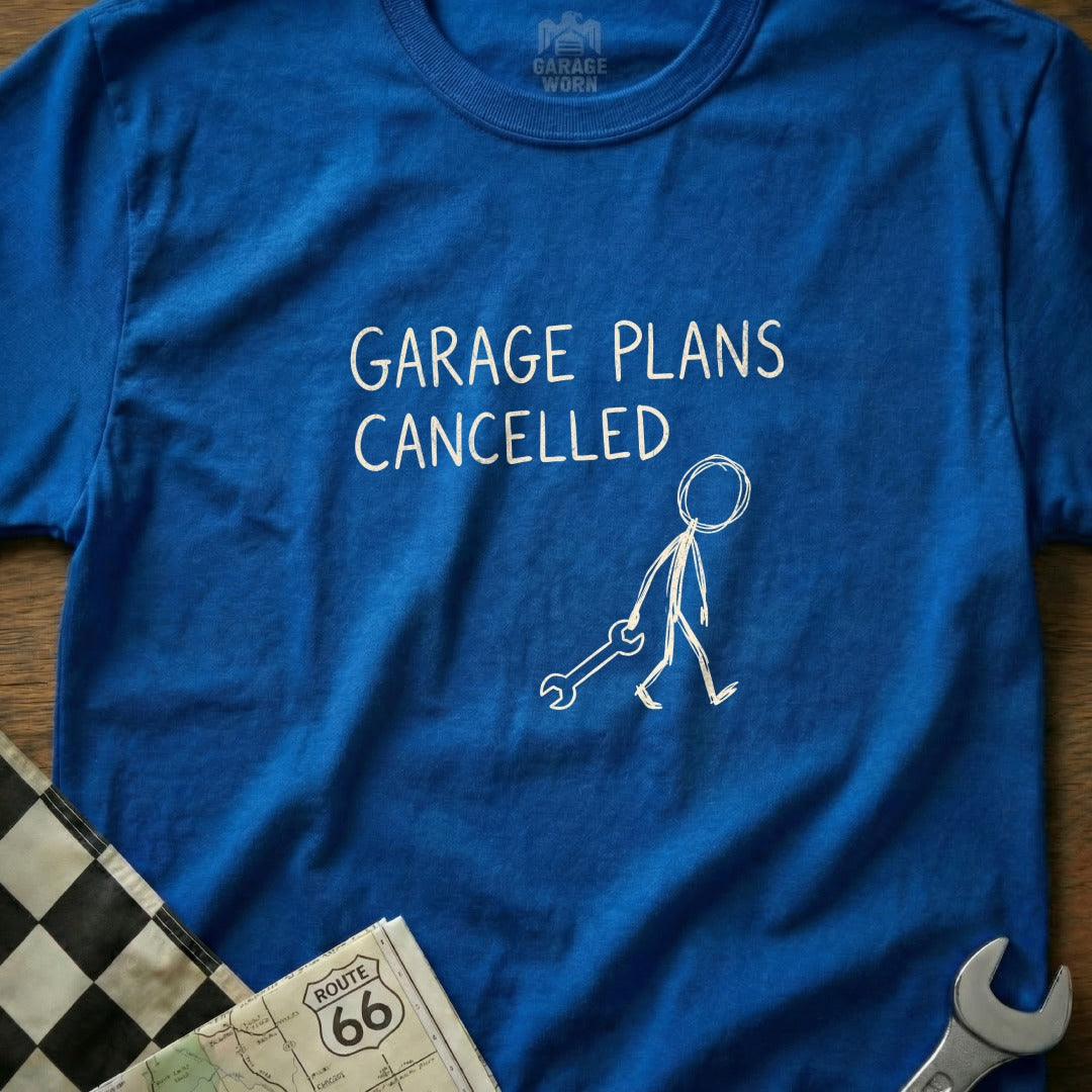 Blue t-shirt with "GARAGE PLANS CANCELLED" and a stick figure holding a wrench.