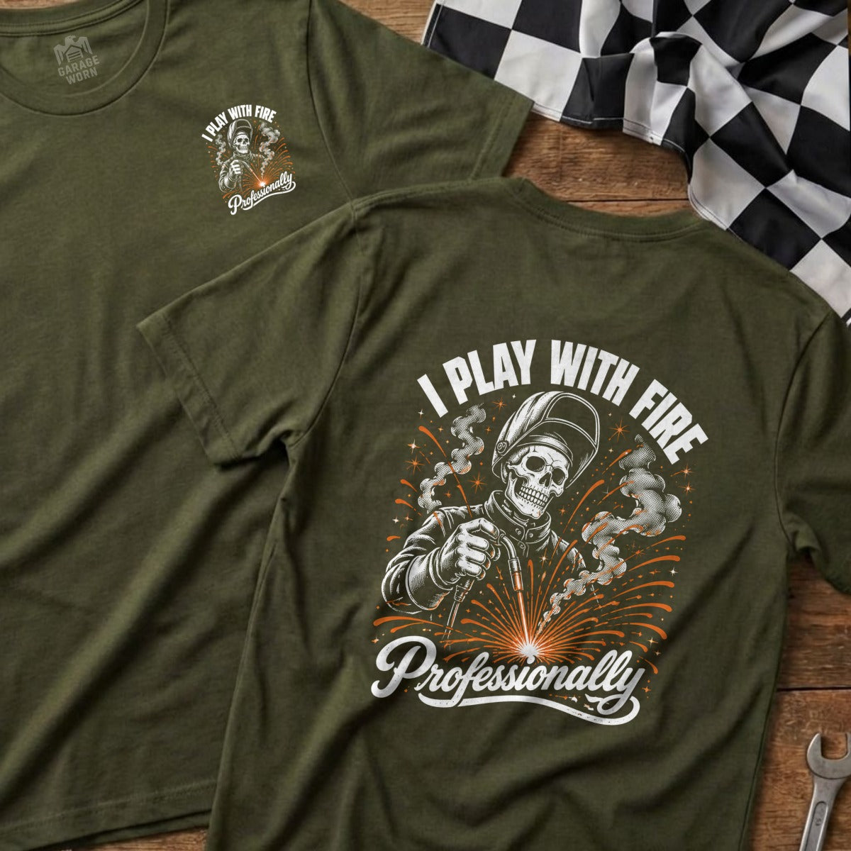 Green t-shirt with welding skeleton graphic: "I PLAY WITH FIRE Professionally".