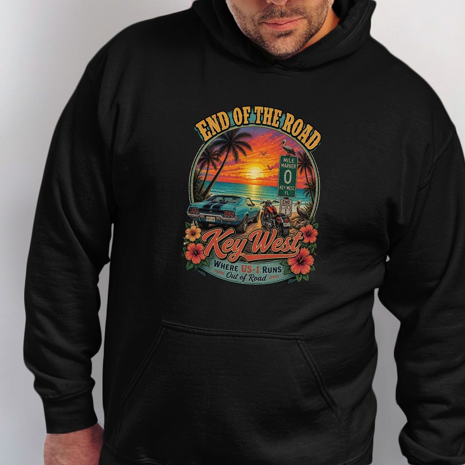 Key West graphic with car, motorcycle, sunset, palm trees, and text "End of the Road".