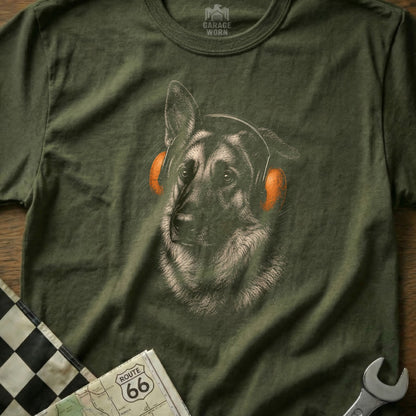 German Shepherd wearing orange headphones on green shirt with Route 66 map.