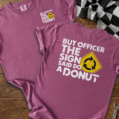 Purple t-shirts with white text saying "But Officer, the sign said do a donut".