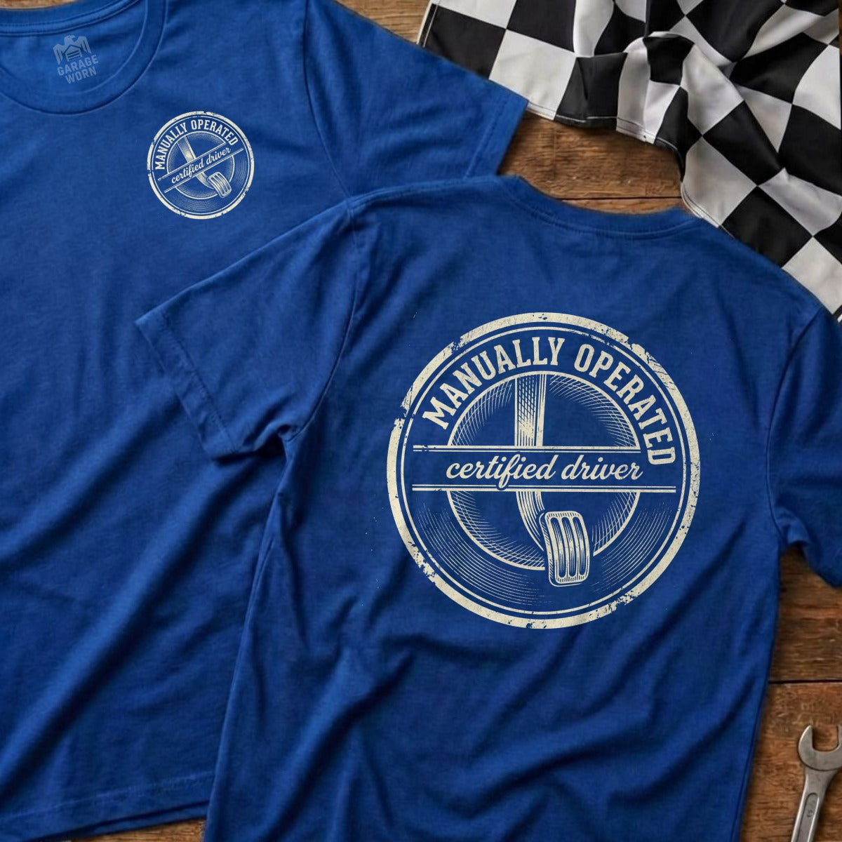 Blue t-shirt with "Manually Operated Certified Driver" text and logo.