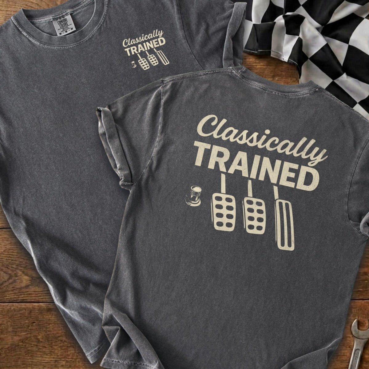 T-shirt with "Classically TRAINED" text and clutch, brake, and gas pedals graphic.