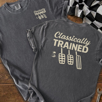 T-shirt with "Classically TRAINED" text and clutch, brake, and gas pedals graphic.