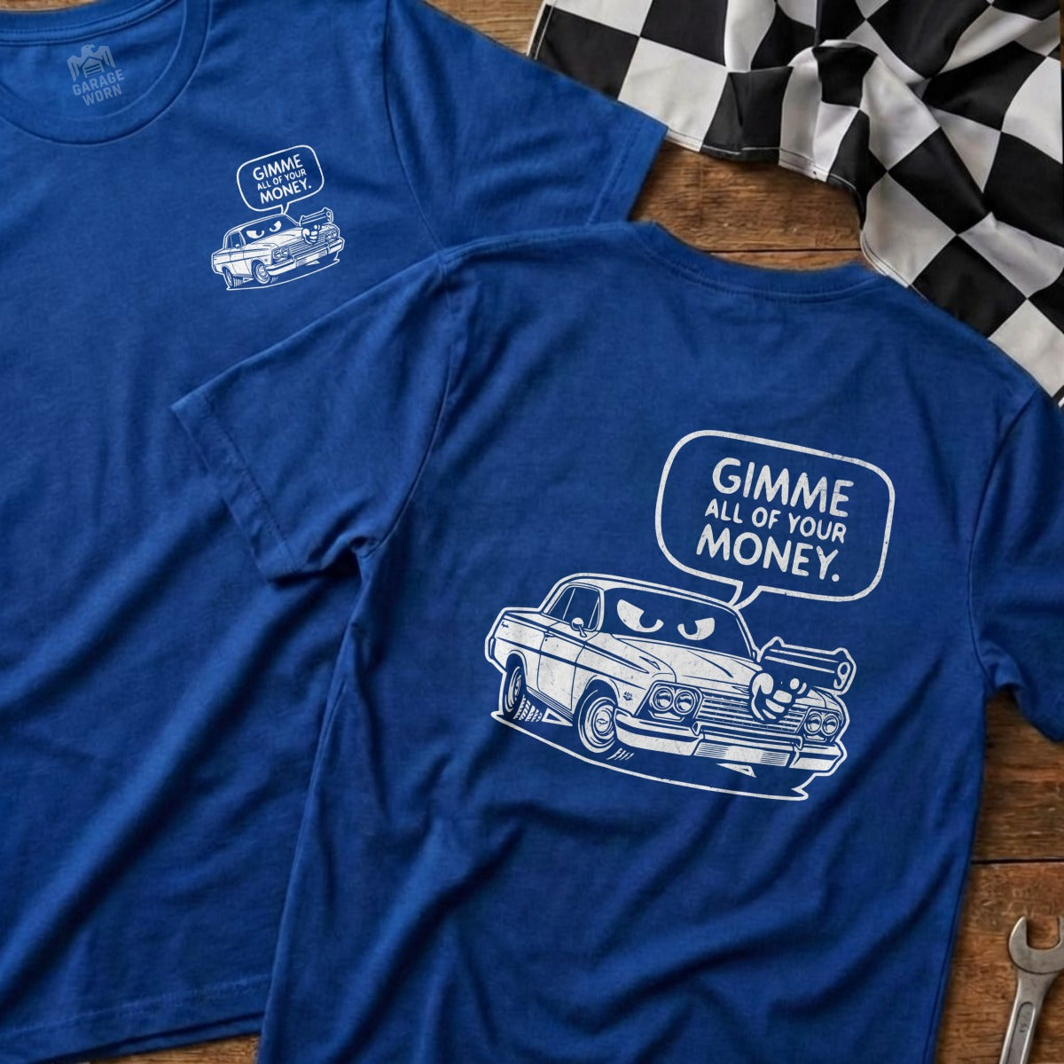 Blue t-shirt with a cartoon car saying "Gimme all of your money."