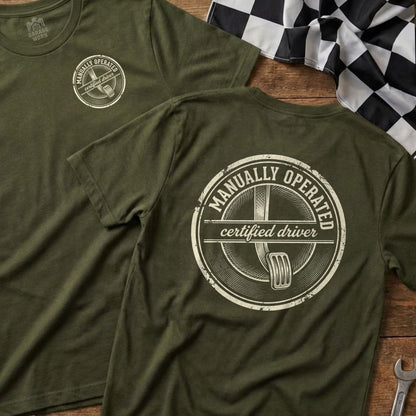 Olive t-shirt with "Manually Operated Certified Driver" emblem on back.