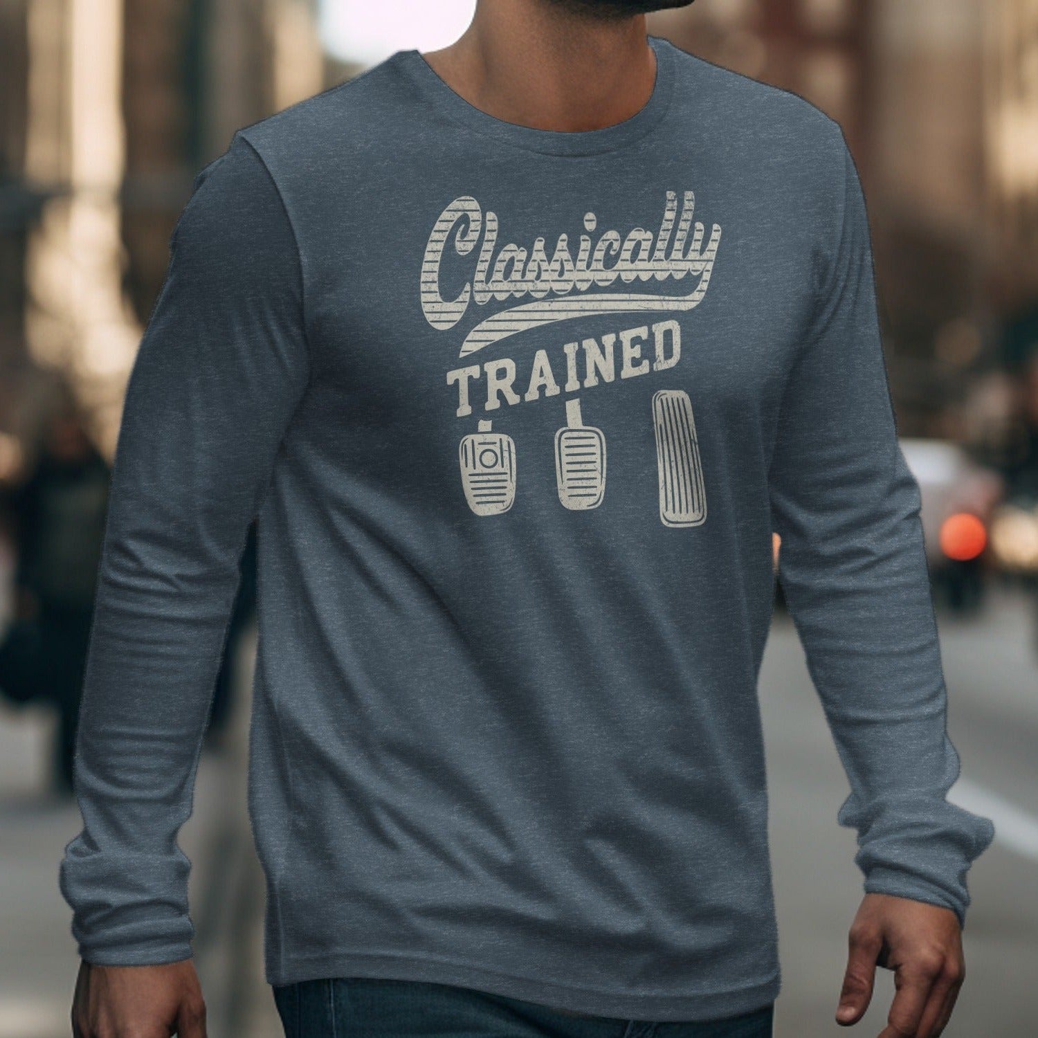 Grey long sleeve shirt with "Classically TRAINED" and clutch pedals graphic.