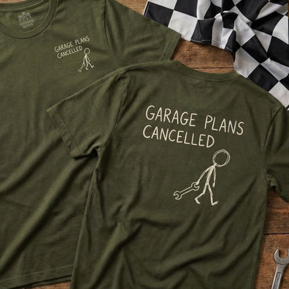 Two olive green t-shirts featuring "GARAGE PLANS CANCELLED" and a stick figure with a wrench.