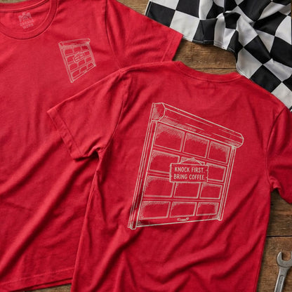 Red t-shirt with a sketch of a garage door and text "KNOCK FIRST. BRING COFFEE."