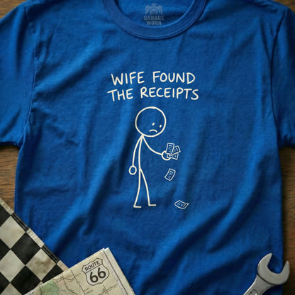 Blue t-shirt with stick figure holding receipts, text reads "Wife Found The Receipts."