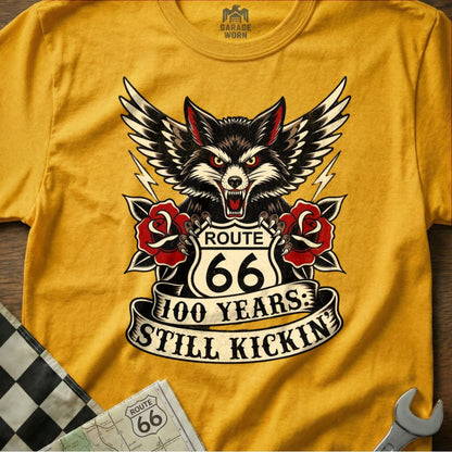 Yellow t-shirt with wolf, Route 66, roses, and lightning bolts graphic.