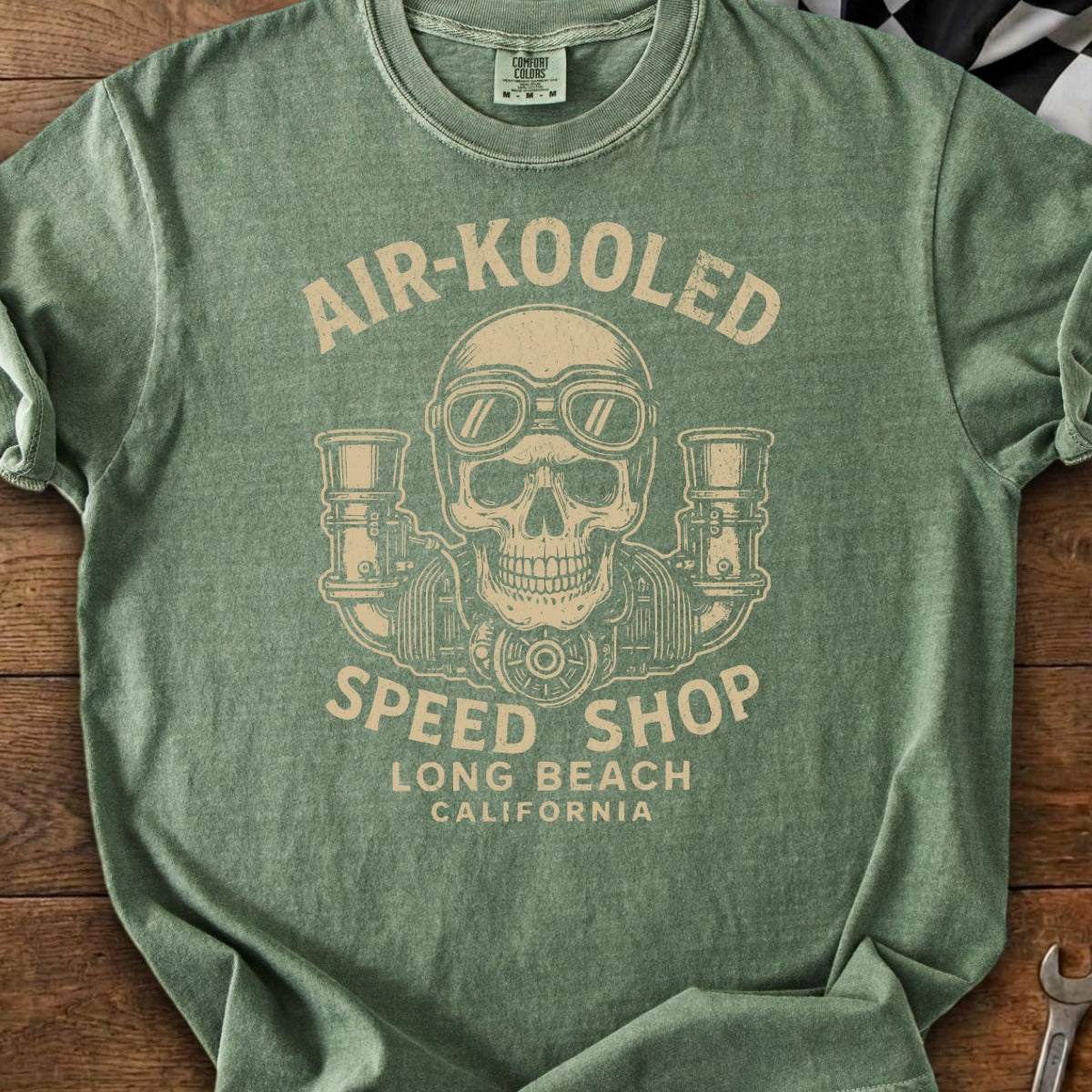 Green t-shirt with "AIR-KOOLD SPEED SHOP LONG BEACH CALIFORNIA" text and skull graphic.